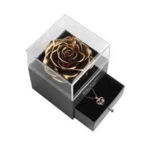 gold rose in the acrylic box 